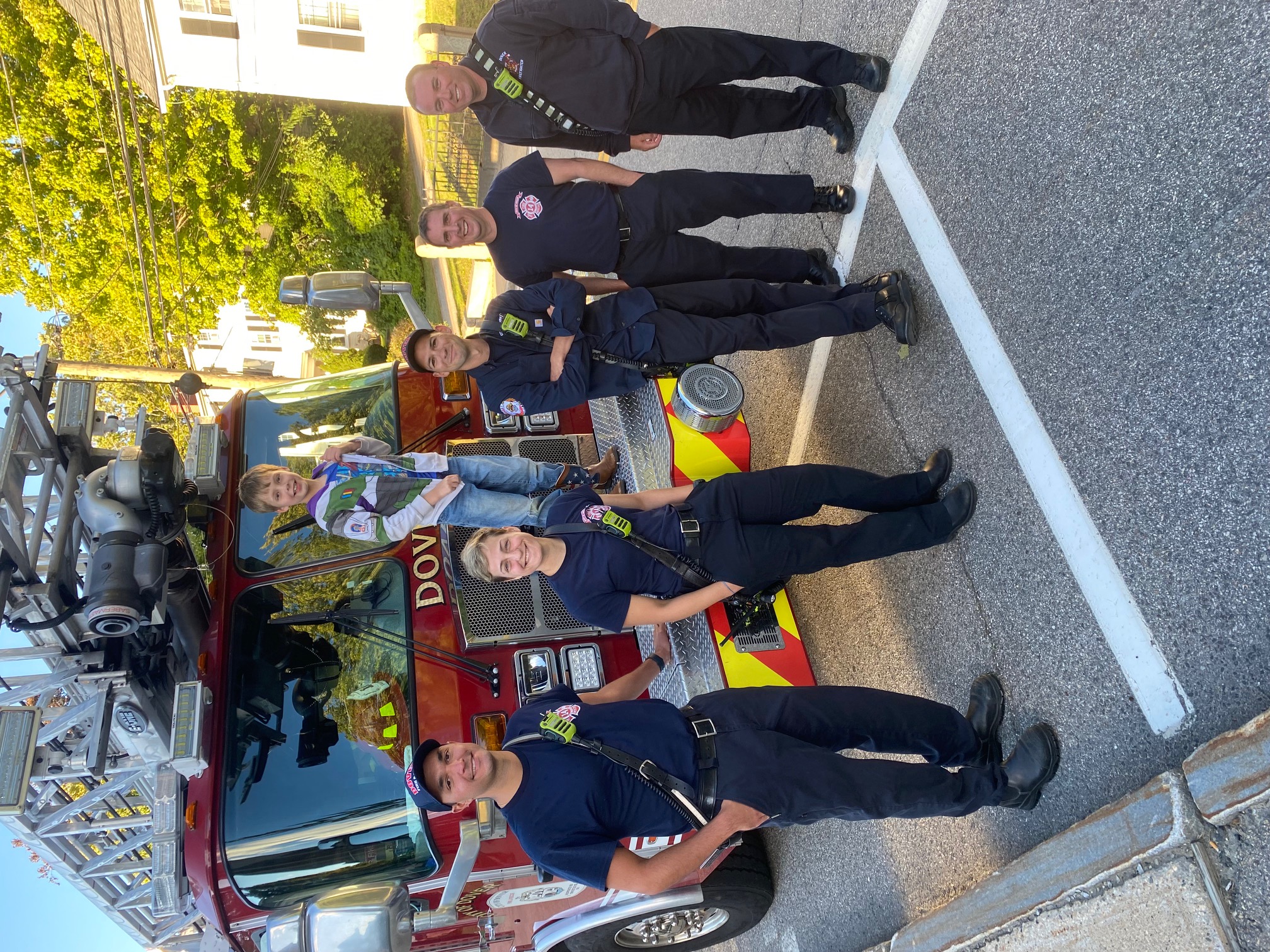 Dover FD crew posing with potential future Sir Knight for the Blessing of the Vehicles by Fr